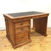 A 19thc style pedestal desk, the rectangular top with inset writing surface above a pair of pull out