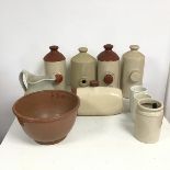 An assortment of stoneware objects including five water bottles (13cm x 28cm x 11cm), one missing