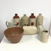 An assortment of stoneware objects including five water bottles (13cm x 28cm x 11cm), one missing
