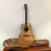 An accoustic guitar by Ovation, of typical form, to include a felt lined carry case by B.W.S. (l.