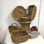 A collection of wicker ware baskets including one in the form of a duck, one with a hinged handle