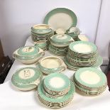 A 1930s Burleigh ware dinner service all with mint green edge and partially gilded, including soup