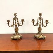 A pair of 20thc brass candelabra in the Neoclassical taste, each baluster shaped shaft embellished