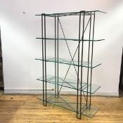 A modern metal framed display cabinet, the angular supports with five strengthened glass shelves,