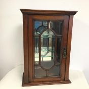 A table top display cabinet, c.1900, the rectangular top with moulded edge above a single hinged