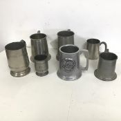 A collection of pewter mugs including those engraved RMS Viceroy of India, Canadian Mountain