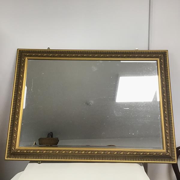 A Classical style wall mirror with composition gilt frame (77cm x 104cm)