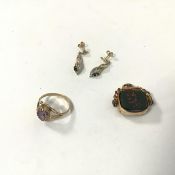 A 9ct gold ring with single amethyst in claw setting (O) (1.94g), a pendant with fob showing a