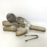 A pair of silver Georgian sugar tongs (l.14cm) (34.26g), a pair of clothes brushes both with