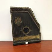 An early 20thc ebonised and gilt highlighted harp of typical form with metal strings and sound board