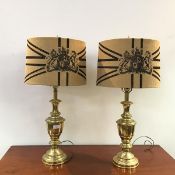 A pair of modern brass table lamps of baluster form, with fabric shades (h.74cm)