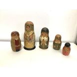 Two Russian painted wooden Matryoshka nesting dolls, probably early 20th century, one of three