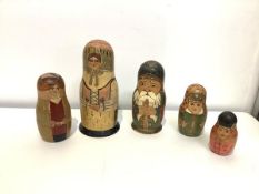 Two Russian painted wooden Matryoshka nesting dolls, probably early 20th century, one of three