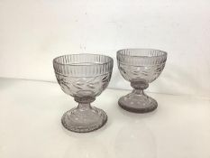 A pair of cut-glass pedestal bowls, early 19th century, possibly Irish, each bell-shaped bowl with a