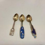 A group of three Danish sterling silver and enamel Christmas spoons by A. Michelsen, Copenhagen: