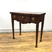 An early 19th century French foldover tea table, the hinged breakfront top above a frieze drawer, on