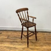 A late 19th century elm and mixed timber child's high chair, the turned spar back within baluster