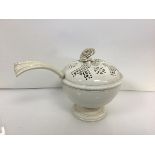 A 19th century creamware tureen and ladle, the pierced domed cover with flowerhead knop, the bowl
