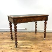 A Victorian figured walnut writing desk, the rectangular top with tooled writing surface, above a