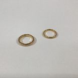 Two 22ct gold wedding bands, ring sizes, ring sizes O and M. (2) Total weight 10 grams