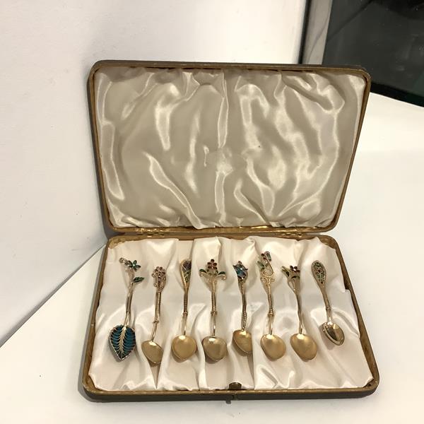 A group of eight Norwegian silver-gilt and plique-a-jour enamel coffee or demitasse spoons, six by