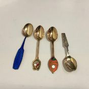 A group of three Danish sterling silver and enamel Christmas year spoons by A. Michelsen,