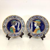 A pair of Deruta maiolica portrait plates, 20th century, the wells painted with a lady and gentleman