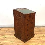 A George IV mahogany Davenport desk, the swivel top with gilt-brass gallery above a bank of four