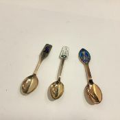 A group of three Danish sterling silver and enamel Christmas spoons by A. Michelsen, Copenhagen,