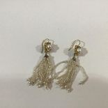 A pair of cultured and seed pearl tassel earrings, each with a c. 6mm cultured pearl in a yellow