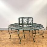 A wrought-iron tree bench, of circular form, in two sections, the rectangular back incorporating