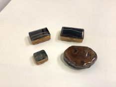 A group of four 19th century agate boxes: two in banded agate, rectangular, with gilt-metal