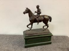 French School, a patinated metal bronze group of a horse and jockey, unsigned, mounted on a gilt-
