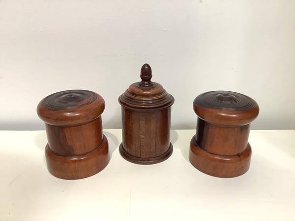 A pair of 19th century lignum vitae string boxes, of turned cylindrical form; together with a