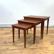 A graduated set of three Danish teak tables, each rectangular top on detachable square tapering