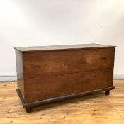 An elm coffer chest, c. 1700, the hinged top with iron brackets enclosing an open interior, above