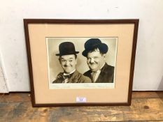 Laurel & Hardy: Stan Laurel (1890-1965) and Oliver Hardy (1892-1957), a sepia photograph, signed