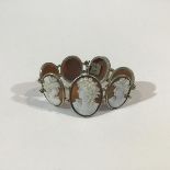 A late 19th century shell cameo bracelet, of seven graduated oval panels, each carved with the
