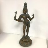 Indian School, a bronze figure of Shiva, modelled standing, with three arms, on a lotus socle.