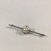 A pearl and diamond-set bar brooch, early 20th century, the off-round pearl (possibly natural,