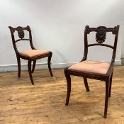 A set of four Scottish Regency mahogany dining chairs, in the Grecian style, each with moulded and