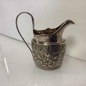 A George III Irish silver cream jug, Dublin 1801 (marks indistinct), of helmet form, with reeded