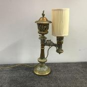 A handsome 19th century brass Colza lamp, the urn-form reservoir with flame finial, the body pierced