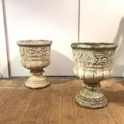 A pair of composition garden urns, of campana form, moulded with Art Nouveau style floral sprays,