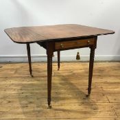 An early 19th century mahogany Pembroke table, of characteristic form, fitted to one end with a