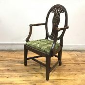 An Edwardian mahogany Sheraton Revival child's chair, with pierced oval back above a drop-in seat,