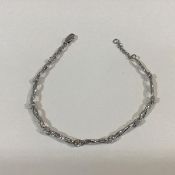 A bracelet, the nine uniform CZ stones claw-set between 9ct white gold