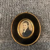 English School, early 19th century, a portrait miniature of a gentleman of sallow complexion,