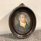 English School, early 19th century, a portrait miniature of an elderly gentleman in yellow waistcoat