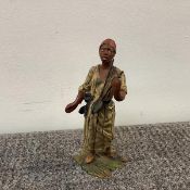 An Austrian cold-painted bronze of an Arab musician, the North African man modelled standing and